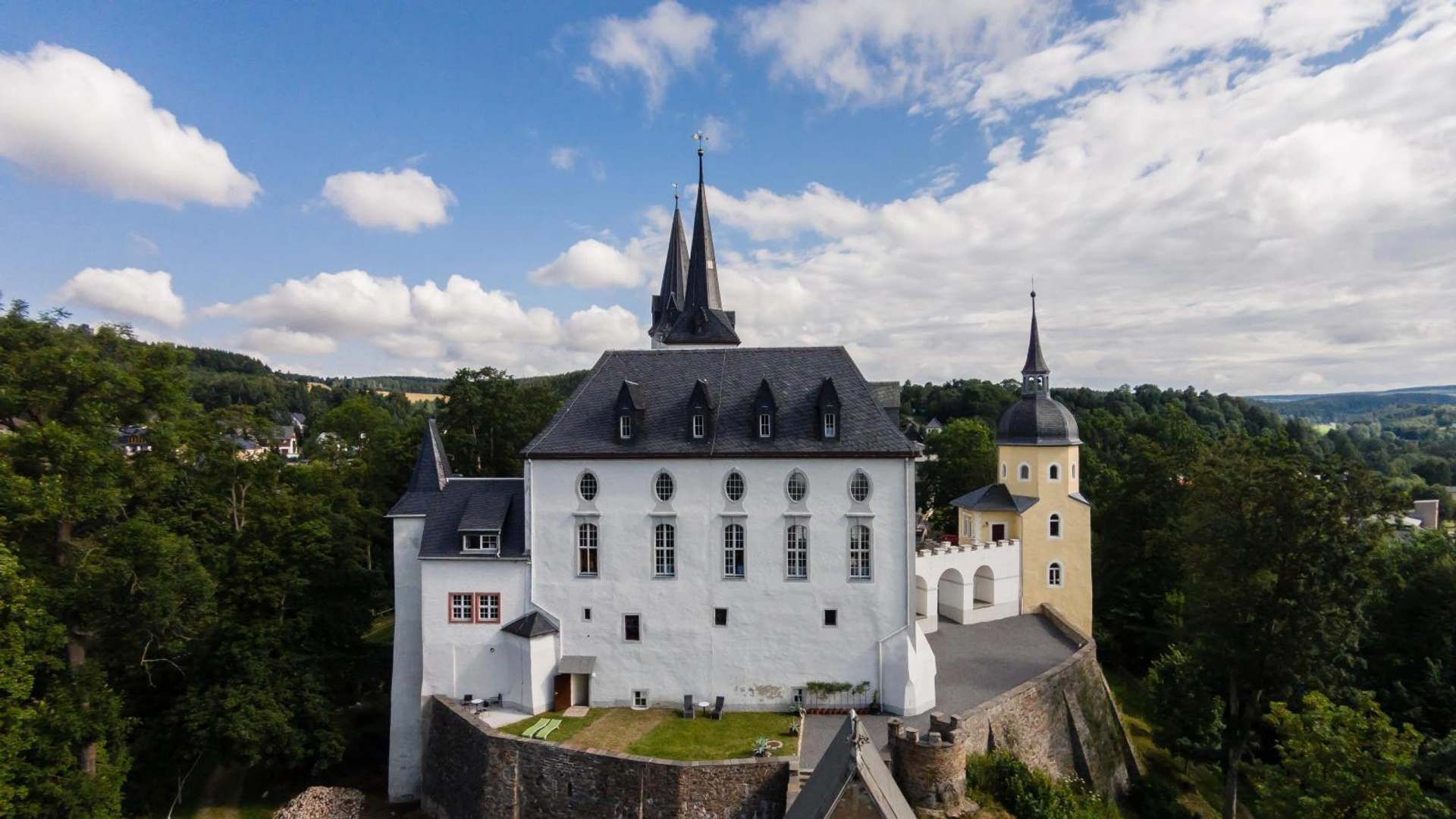 Purschenstein Castle surrounded by forest